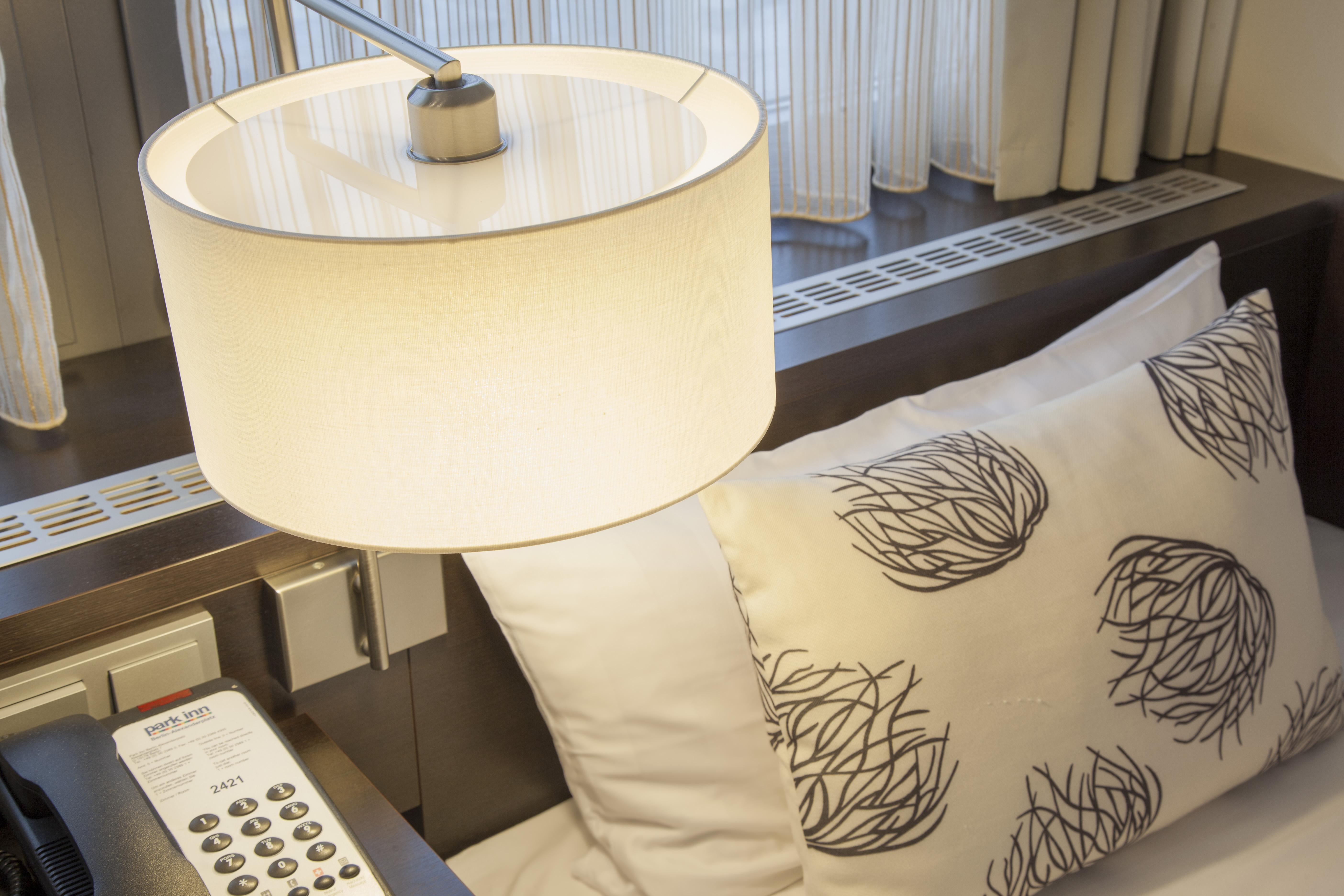 Park Inn By Radisson Berlin Alexanderplatz Esterno foto A table lamp with a table top and a remote control